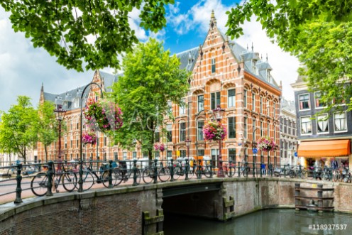 Picture of Typical canal side cityscape of Amsterdam opposite from the 17th century HQ of the Dutch East India Company now used by the University of Amsterdam